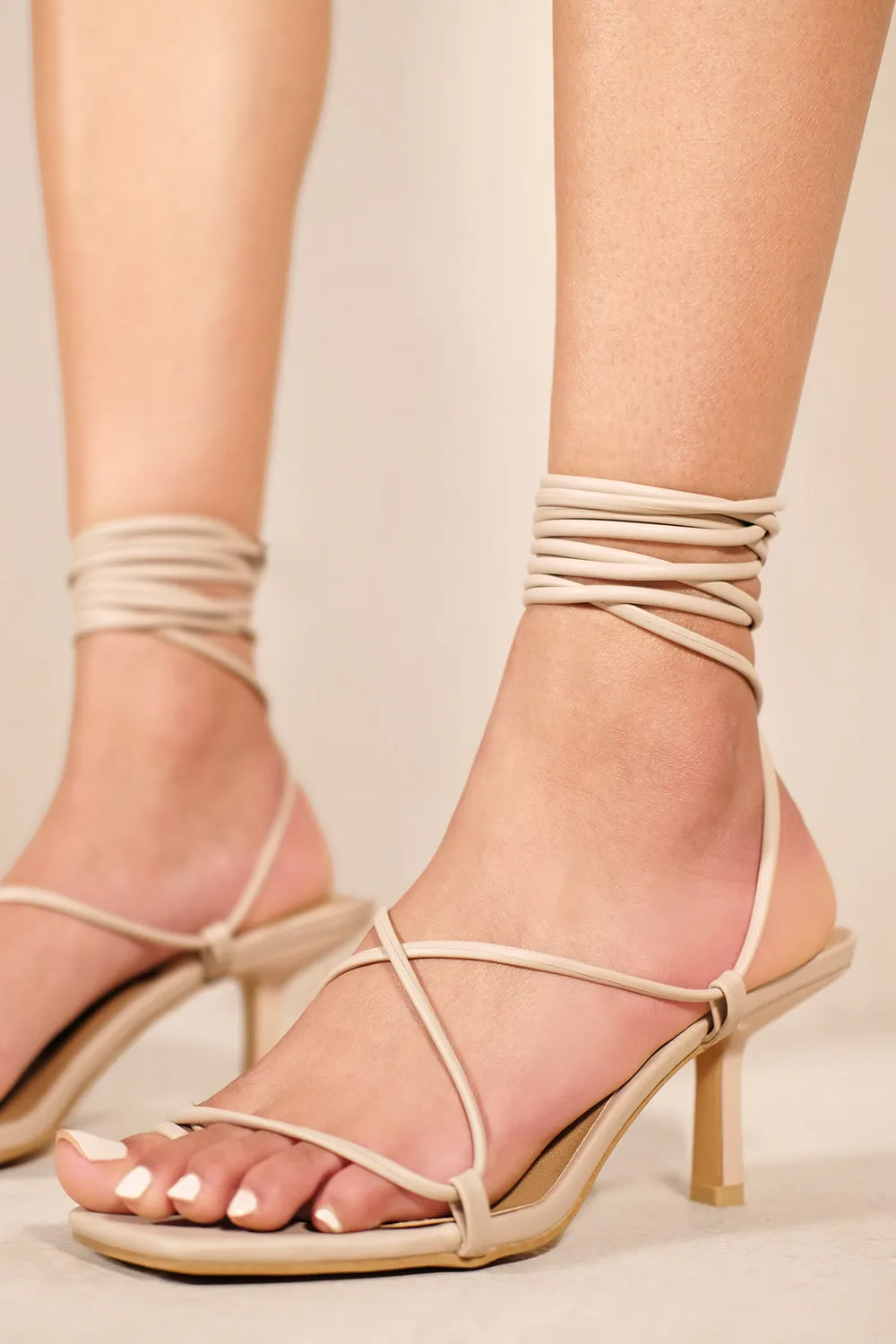 ITZEL LOW HEEL SANDALS WITH SQUARE TOE & LACE UP DETAIL IN NUDE FAUX LEATHER